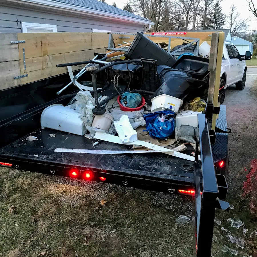 Roll-off dumpster delivered to a residential driveway in Spirit Lake