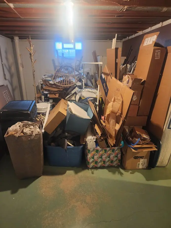 Roll-off dumpster container at job site for 4 Yard Dumpster Rental in Spirit Lake